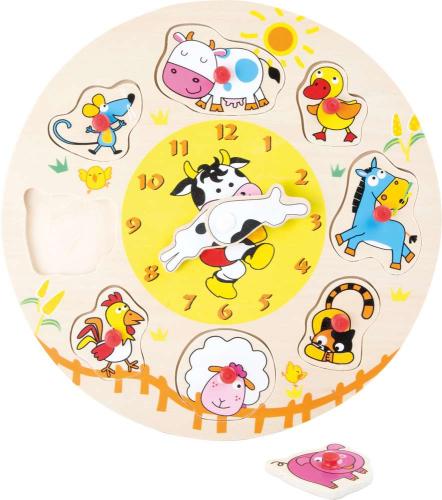 Une horloge éducative en bois où une vache indiquera les heures et les minutes, couplée à un puzzle de 8 pièces représentant des animaux à placer autour de l’horloge.
