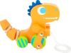 Ce dinosaure accompagnera les premiers pas du petit. L'enfant tirera la ficelle, et le dinosaure le suivra en balançant ses petits bras au rythme des pas.